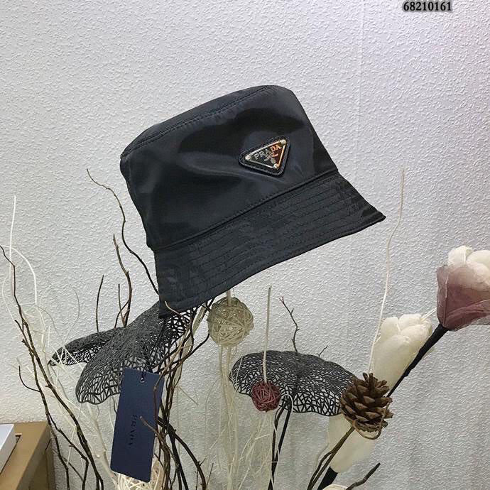 Re Nylon Shearling Trimmed Bucket Hat in White - Prada